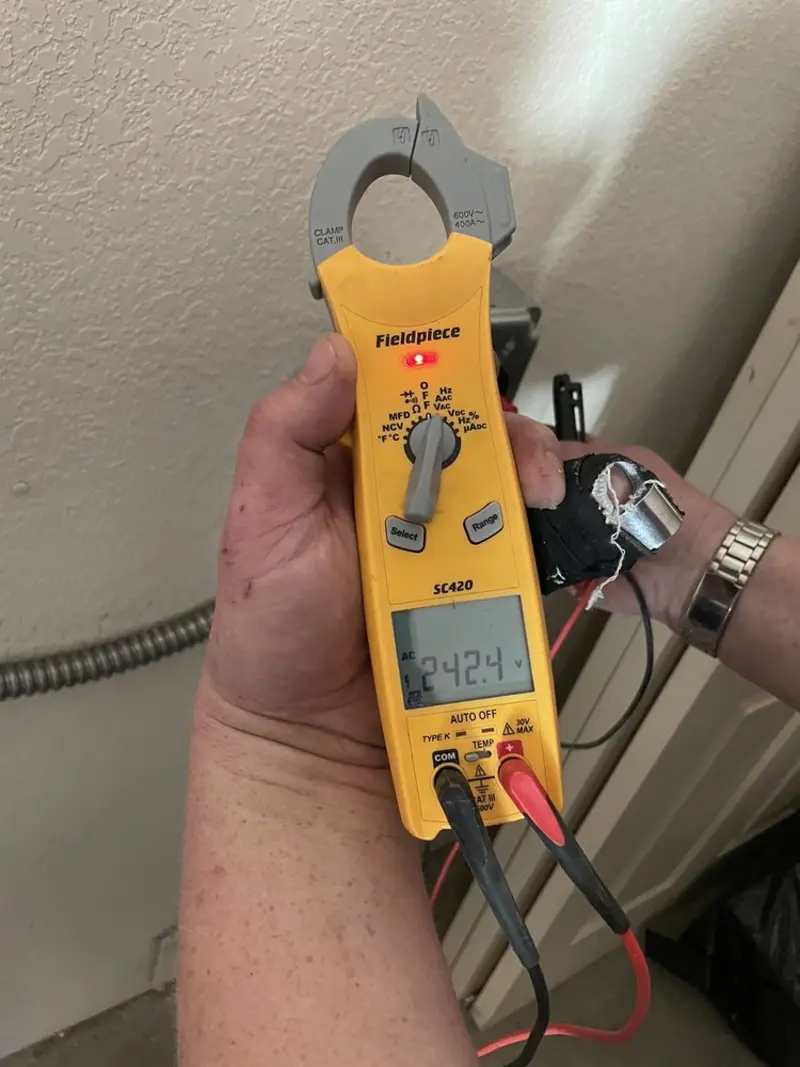 Voltage testing with clamp meter during Recessed Lighting Installation in Eastover